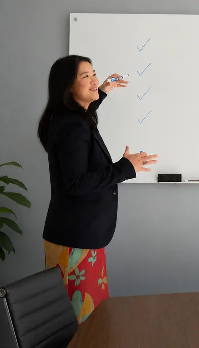 Charlyn reviewing data privacy compliance checklist, representing Rikka Law's free compliance resources for businesses